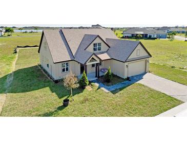 Aerial view of a charming craftsman style home with a large yard at 532 Adams View Ln, Auburndale, FL 33823