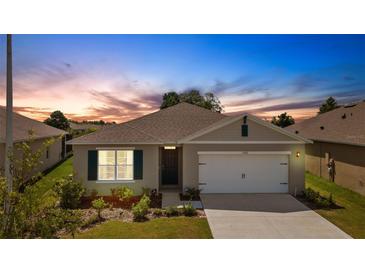 One-story house with a two-car garage and landscaped yard at 5600 Siltstone St, Lakeland, FL 33811