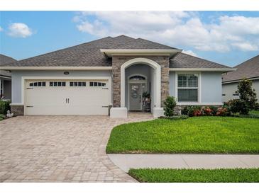 Beautiful one-story home with two-car garage and landscaped lawn at 7914 Lake James Blvd, Lakeland, FL 33810