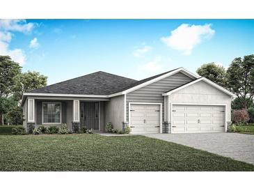 Two-car garage home with gray siding and landscaping at 5478 Duxford Cir, Saint Cloud, FL 34771