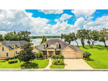 Luxury home on lakefront lot with mature landscaping at 4848 Island Shores Ln, Lakeland, FL 33809