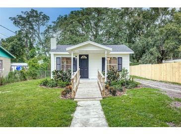 Charming bungalow with a welcoming front porch and landscaped yard at 2429 Lakeview St, Lakeland, FL 33801