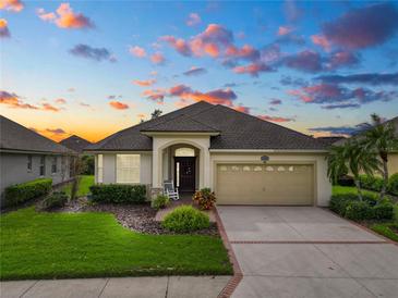 One-story home with a two-car garage and landscaped yard at 2356 Lake James Way, Lakeland, FL 33810