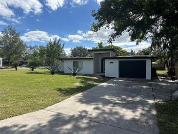 Mid-century modern home with a large front yard at 2128 Sycamore Dr, Winter Park, FL 32789