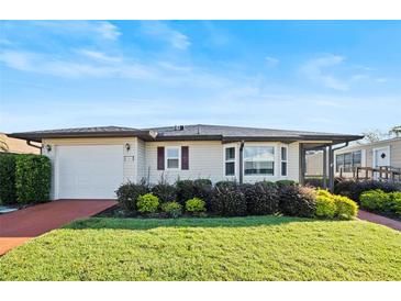 Charming single story home with well-manicured lawn at 4904 Goldenview Ln, Lakeland, FL 33811