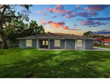 Ranch style home with front yard at 4969 Lake Pierce Dr, Lake Wales, FL 33898