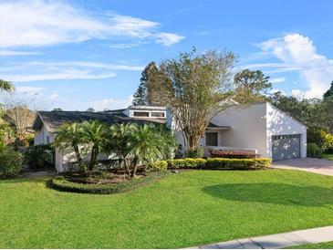 Beautiful home with lush landscaping and a spacious yard at 83 Shadow Ln, Lakeland, FL 33813