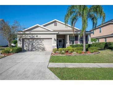 One-story home with a two-car garage and landscaped front yard at 1849 Charleston Ln, Bartow, FL 33830