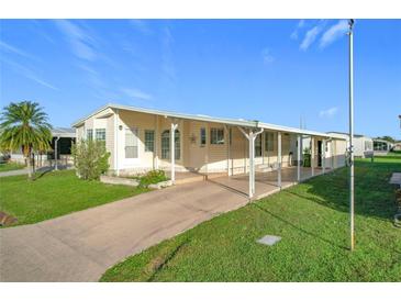 Single wide mobile home with carport at 6461 Hollyberry Ne Ln, Winter Haven, FL 33881