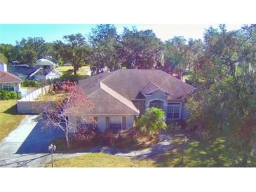 Large single Gathering home with spacious yard and mature trees at 5635 Canvasback Ct, Lakeland, FL 33805