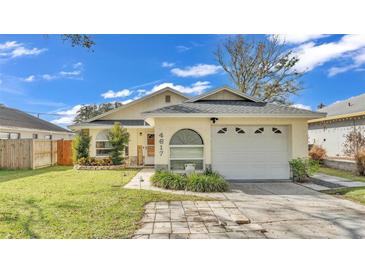 Charming single-story home with attached garage and landscaped front yard at 4617 S Devon Ave, Lakeland, FL 33813