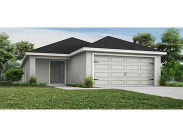One-story home with gray siding, black roof, and attached two-car garage at 1839 Daystar Dr, Haines City, FL 33844