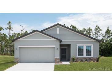 Beautiful two-story home with a two-car garage and stone accents at 3527 Fernanda Dr, Deltona, FL 32738
