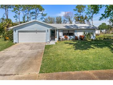 Charming single-story home with a well-maintained lawn at 1213 Jeffery Dr, Port Orange, FL 32129