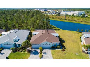 Two-story homes with attached garages and waterfront views at 933 Attitude Ave, Daytona Beach, FL 32124