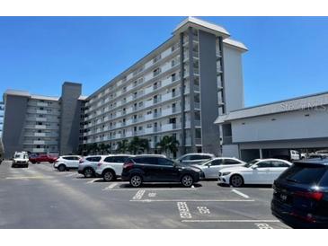 Exterior view of a multi-story building with parking at 101 N Riverside Dr # 611, New Smyrna Beach, FL 32168