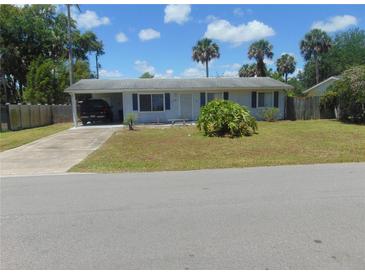 Single story home with carport and fenced yard at 1846 Royal Palm Dr, Edgewater, FL 32141