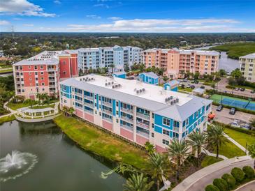 Aerial view of waterfront community with tennis court at 1 Riverwalk Dr # 206, New Smyrna Beach, FL 32169