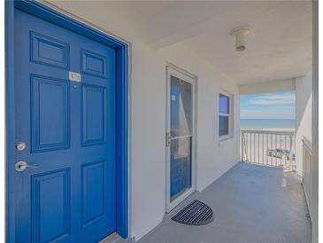 Blue door to condo with ocean view from balcony at 1111 Hill St # U3, New Smyrna Beach, FL 32169