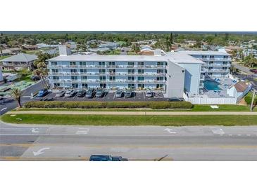 Multi-story building with pool and ample parking at 3700 S Atlantic Ave # 402, New Smyrna Beach, FL 32169