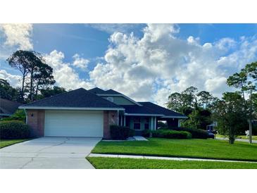 Single story home with attached garage and well maintained lawn at 101 Braeburn Cir, Daytona Beach, FL 32114