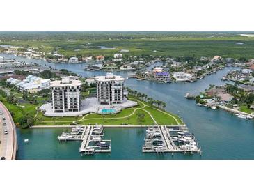 Aerial perspective of waterfront property with boat slips at 501 N Causeway # 2050, New Smyrna Beach, FL 32169