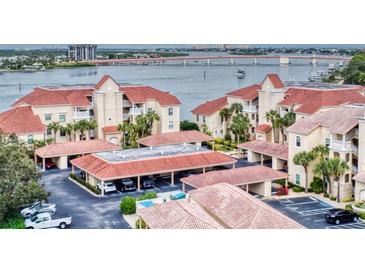 Aerial view of waterfront community with parking and boat access at 438 Bouchelle Dr # 104, New Smyrna Beach, FL 32169