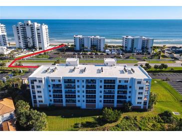 Oceanfront property with condo building and parking area, near beach access at 5300 S Atlantic Ave # 17-506, New Smyrna Beach, FL 32169