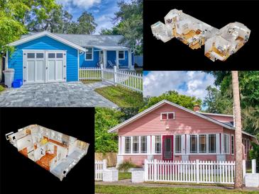 Charming pink bungalow home with white picket fence and red door at 205 Mary Ave, New Smyrna Beach, FL 32168