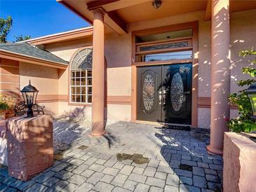 Inviting front entrance with double doors and a brick walkway at 216 Ocean Dr, New Smyrna Beach, FL 32169