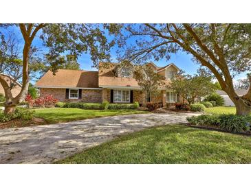Charming two-story home with landscaped yard and large driveway at 839 Fairway Dr, New Smyrna Beach, FL 32168