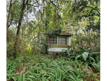 A mobile home nestled in a wooded area at 526 Shepard Rd, Orlando, FL 32833