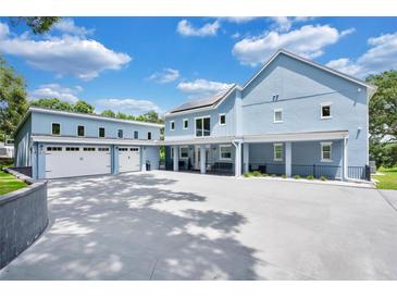 Stunning two-story home with a detached garage and driveway at 1317 Spring Lake Ter, Ocoee, FL 34761