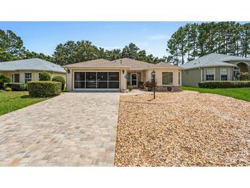 Single-story home with a paved driveway at 9656 Sw 93Rd Loop, Ocala, FL 34481