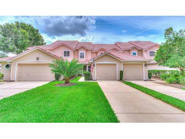 Two-story townhouses with attached garages at 28 Golf Villa Dr, Port Orange, FL 32128