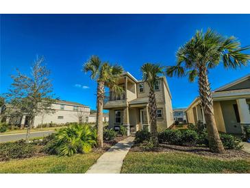 Two-story home with balcony and tropical landscaping at 728 Costa Ln, Debary, FL 32713