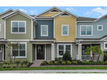 Three-unit townhome building with modern exterior and landscaping at 1463 Alston Bay Blvd, Apopka, FL 32703