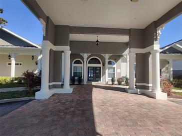 Elegant community entrance with covered walkway at 3174 Feltrim Pl # 201, Kissimmee, FL 34747