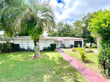Charming ranch-style home with well-manicured lawn at 2308 Lake Helen Osteen Rd, Deltona, FL 32738