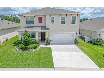 Two-story house with a two-car garage at 418 Anne St, Deland, FL 32724