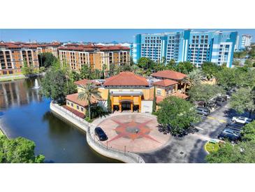 Resort-style community with lake and building views at 12544 Floridays Resort Dr # 503-B, Orlando, FL 32821