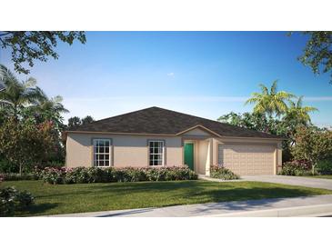 Single-story home with a two-car garage and well-manicured lawn at 5081 Ives Ave, De Leon Springs, FL 32130
