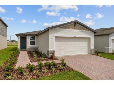 Single-story home with two-car garage at 1357 Current Pl, Haines City, FL 33844