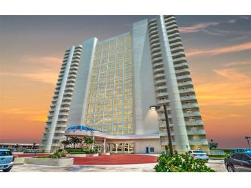 Tall white building with many windows and balconies at sunset at 2545 S Atlantic Ave # 2107-2108, Daytona Beach Shores, FL 32118