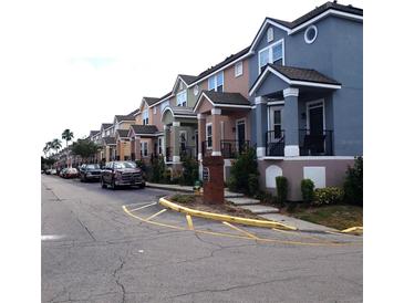 Row of colorful townhouses with parking at 6682 Time Square Ave # 101, Orlando, FL 32835