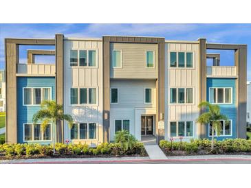 Modern building exterior with blue and gray accents at 7770 Sandy Ridge Dr # 227, Reunion, FL 34747