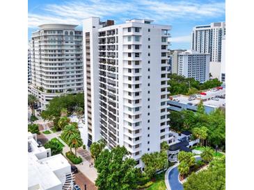 High-rise building with city views and lush landscaping at 530 E Central Blvd # 802, Orlando, FL 32801