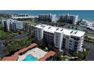 Aerial view showing the community pool and oceanfront location at 5300 S Atlantic Ave # 8-207, New Smyrna Beach, FL 32169