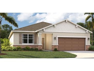 One-story home with brown garage door and light brown accents at 6519 Waterlily Pl, Haines City, FL 33844