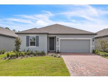 Two-car garage and front yard landscaping at 3116 Legends Preserve Dr, Daytona Beach, FL 32124
